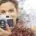 pretty girl holding a camera