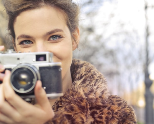 pretty girl holding a camera