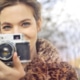 pretty girl holding a camera